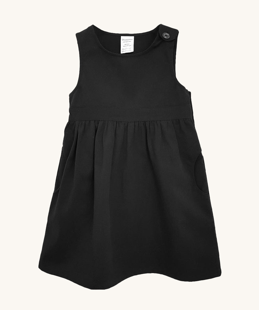 The Eco Outfitters organic and fair trade cotton school pinafore dress in black.