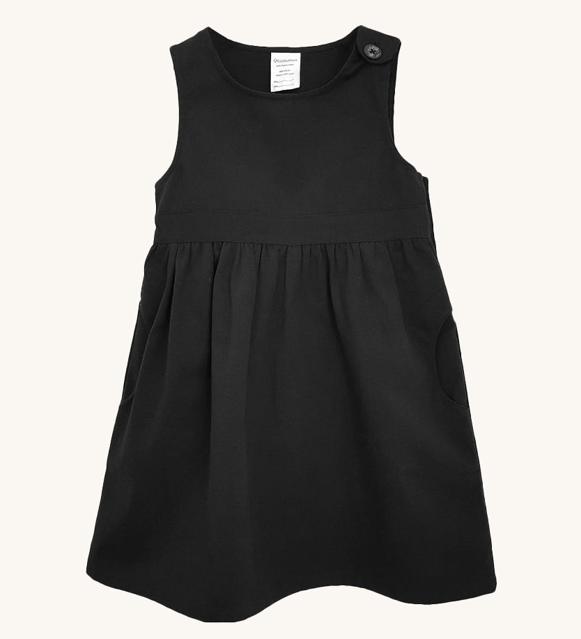 The Eco Outfitters organic and fair trade cotton school pinafore dress in black.