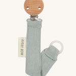 Avery Row Pacifier Holder - Blue Corduroy, showing the silicone ring and wooden clip
