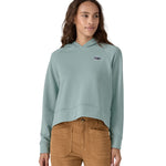 A person wearing the Patagonia Women's Regenerative Essential Hoody in light blue