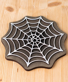Bumbu handmade and hand painted white cobweb piece on a black back piece available at Babipur ideal for a spooky playscene