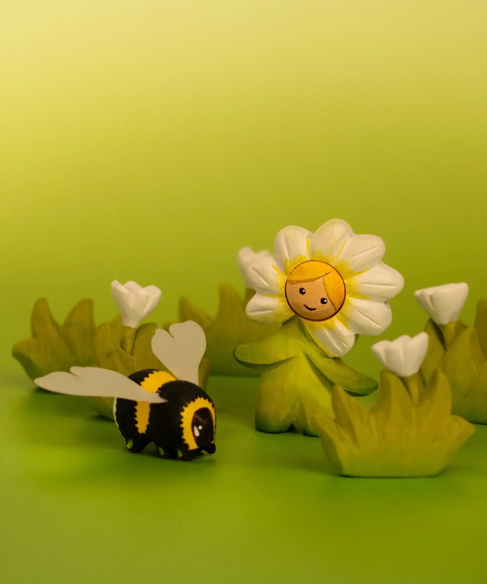 Bumbu wooden daisy flower child figure showing hand painted facial features standing next to a wooden bee