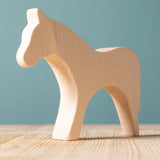 Bumbu paint your own wooden toy horse. A smooth and natural finish with wood grain showing.