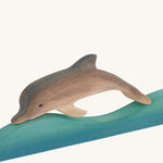 Bumbu Wooden Dolphin figure on a plain background.