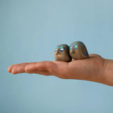 Medium Bumbu handcrafted wooden love birds in adult hand