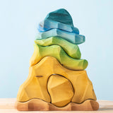 Bumbu handmade and hand painted wooden reef set available at Babipur. A set containing 7 ocean inspired coloured pieces making a reef.