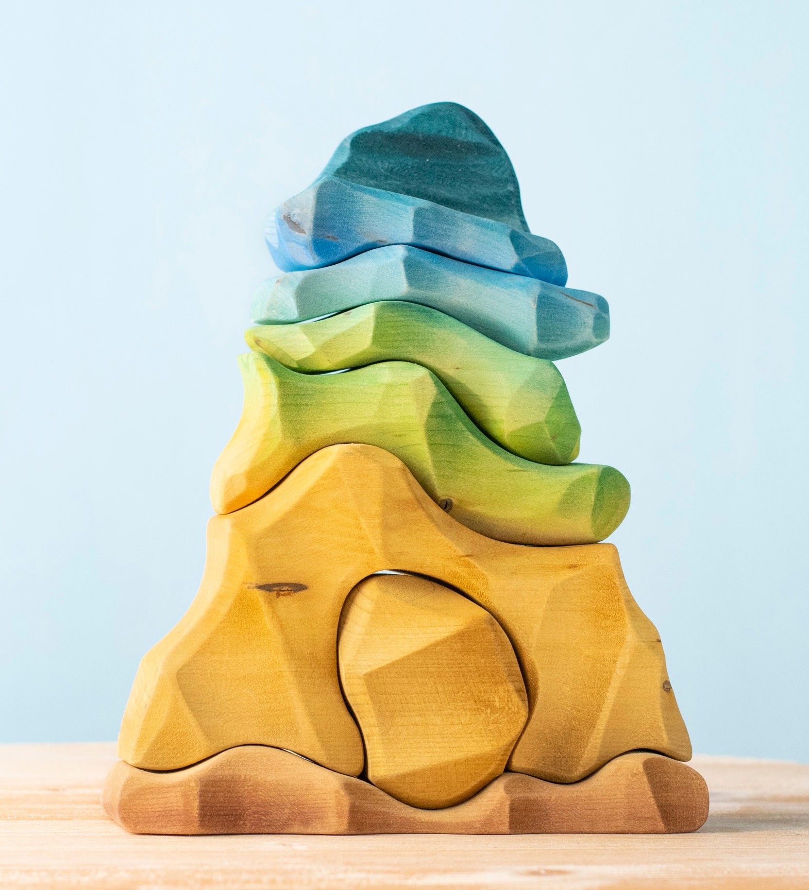 Bumbu handmade and hand painted wooden reef set available at Babipur. A set containing 7 ocean inspired coloured pieces making a reef.