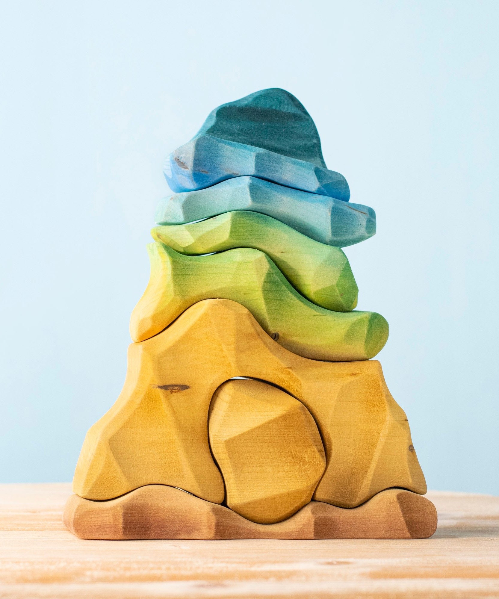 Bumbu handmade and hand painted wooden reef set available at Babipur. A set containing 7 ocean inspired coloured pieces making a reef.