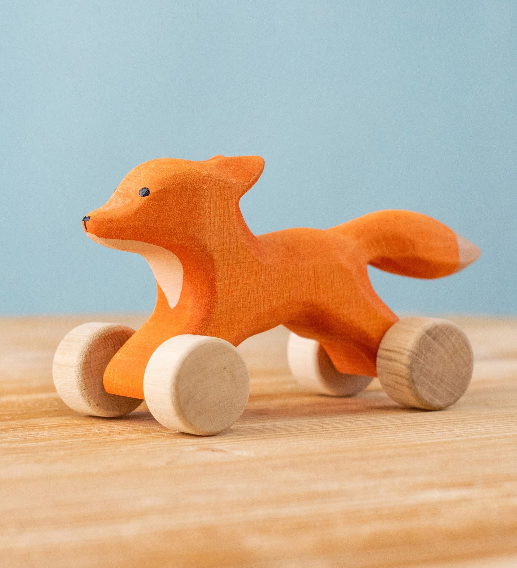Bumbu handmade and hand painted rolling fox available at Babipur. Features wheels as feet for the figure to be used as a push and pull toy. 