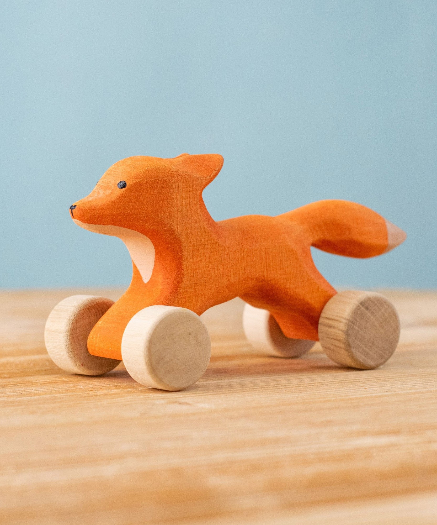 Bumbu handmade and hand painted rolling fox available at Babipur. Features wheels as feet for the figure to be used as a push and pull toy. 