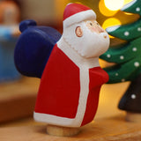 Wooden Bumbu Santa Celebration Ring Figure, this Father Christmas is compatible with the Grimm's Ring - add to a winter display or use as a toy - for sale at Babipur.
