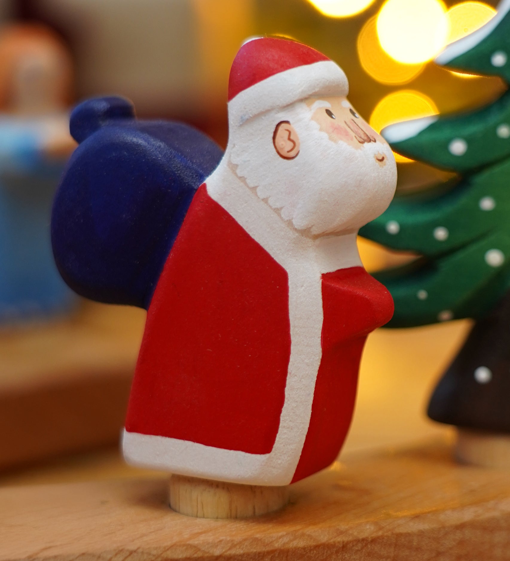 Wooden Bumbu Santa Celebration Ring Figure, this Father Christmas is compatible with the Grimm's Ring - add to a winter display or use as a toy - for sale at Babipur.
