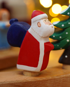 Wooden Bumbu Santa Celebration Ring Figure, this Father Christmas is compatible with the Grimm's Ring - add to a winter display or use as a toy - for sale at Babipur.
