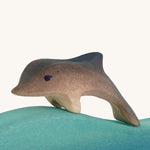 Bumbu wooden baby dolphin figure.