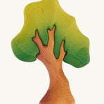 A small Bumbu wooden oak tree on a plain background. 