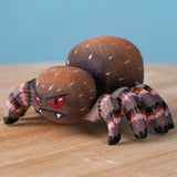 Bumbu handmade and hand painted wooden spider figure with hand painted facial features available at Babipur.