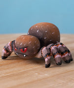 Bumbu handmade and hand painted wooden spider figure with hand painted facial features available at Babipur.