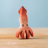 Bumbu handmade and hand painted wooden squid figure with cute painted on eyes available at Babipur 
