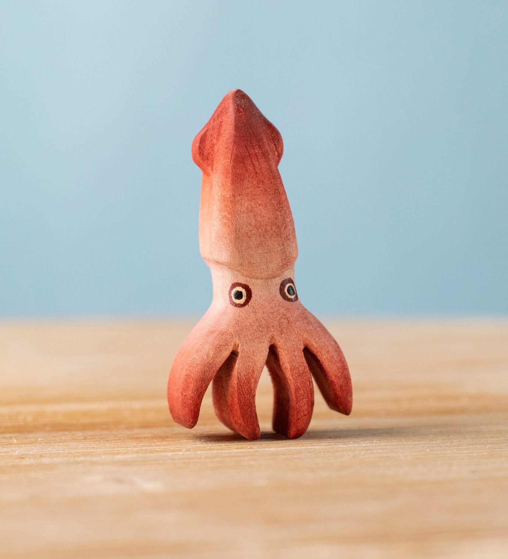 Bumbu handmade and hand painted wooden squid figure with cute painted on eyes available at Babipur 