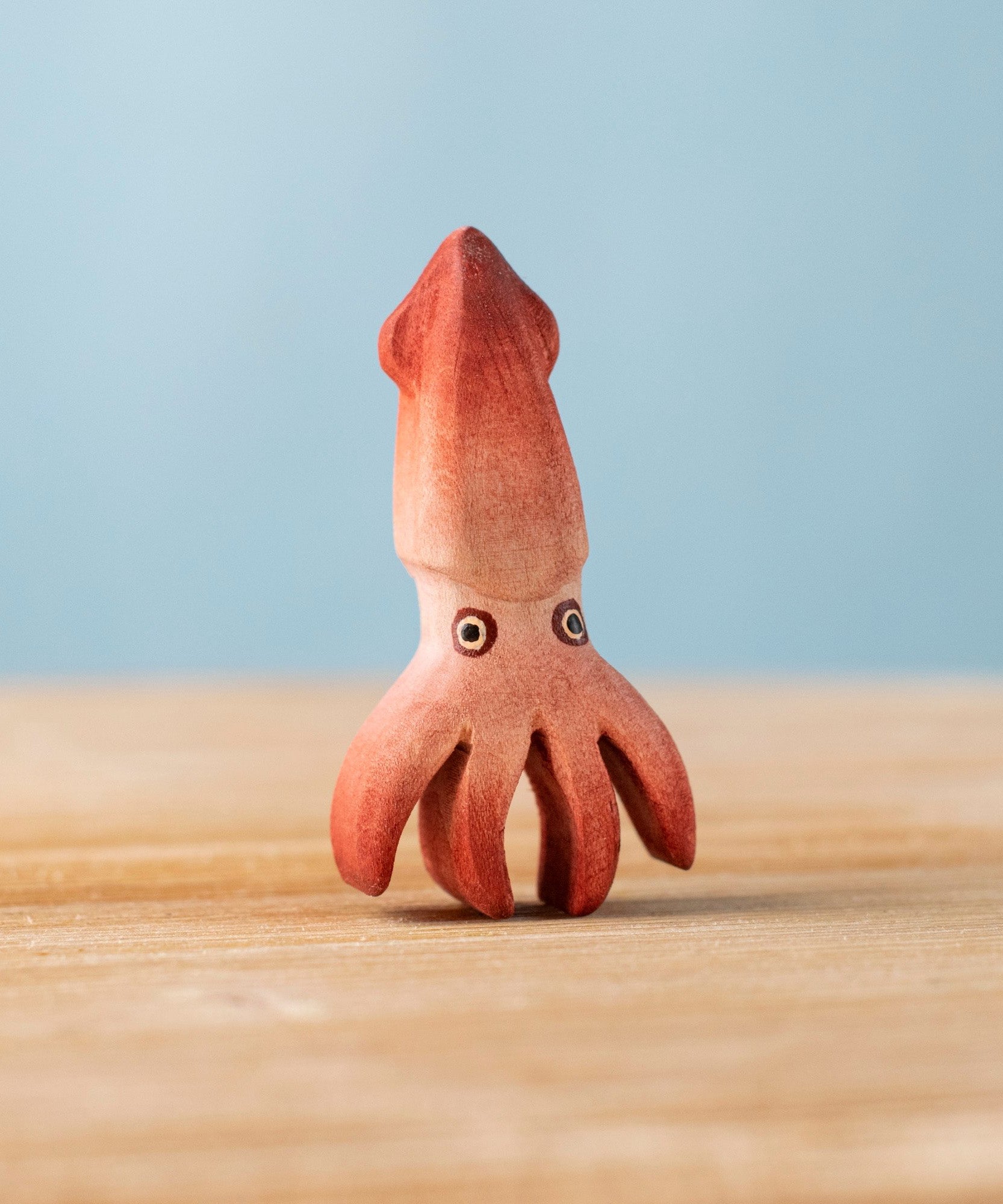 Bumbu handmade and hand painted wooden squid figure with cute painted on eyes available at Babipur 