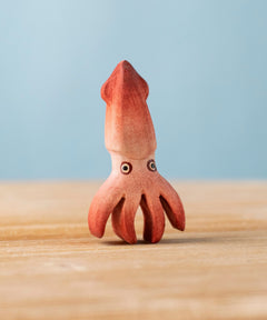 Bumbu handmade and hand painted wooden squid figure with cute painted on eyes available at Babipur 