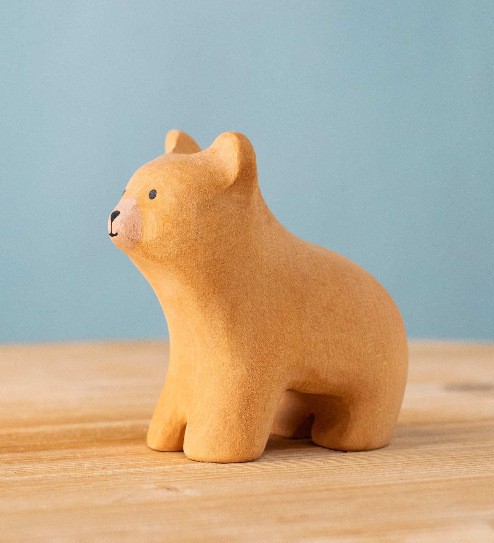 Bumbu handmade and hand painted wooden brown curious bear figure with playful and cute facial features available at Babipur.