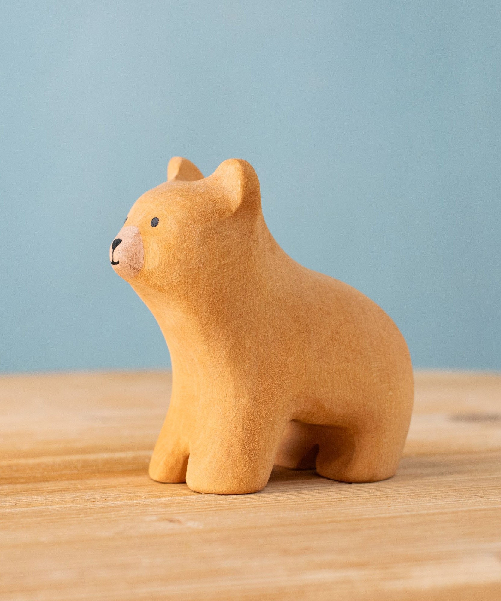 Bumbu handmade and hand painted wooden brown curious bear figure with playful and cute facial features available at Babipur.