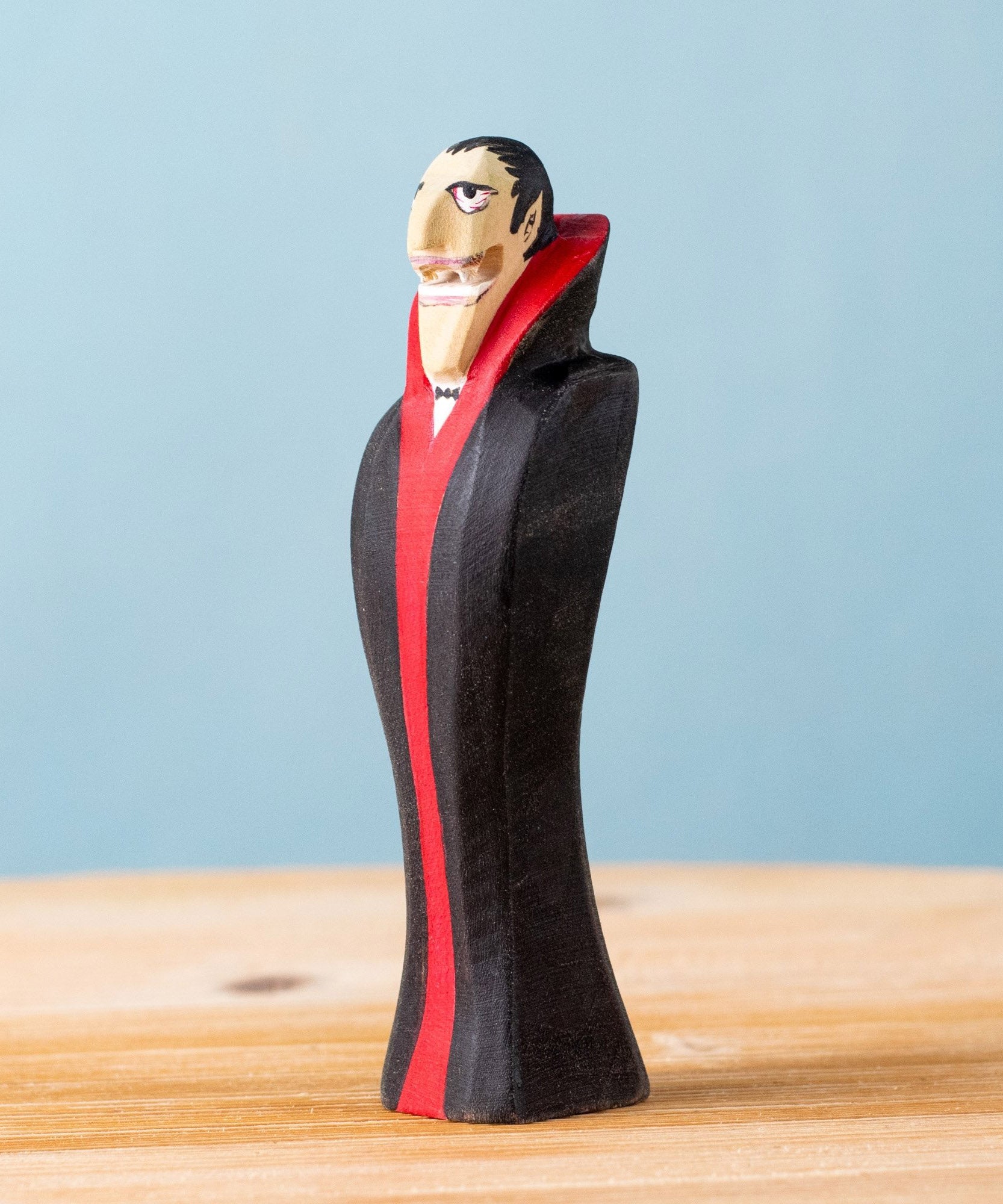 Bumbu handmade and hand painted dracula the vampire figure  with a black and red cape available at Babipur.