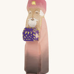 Bumbu wooden caspar three kings figure on a plain background. 