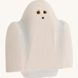 Bumbu wooden ghost figure on a plain background.