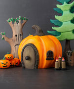 Bumbu handmade and hand painted wooden orange Halloween pumpkin house with other Bumbu spooky inspired figures including pumpkins, candles and a spooky tree available at Babipur.