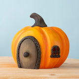 Bumbu handmade and hand painted wooden orange halloween pumpkin house available at Babipur. Features a black window window matching removable door