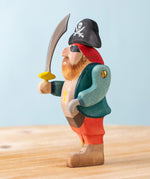 Bumbu handmade and hand painted pirate wooden figure available at Babipur showing the movable arm and hand painted detail
