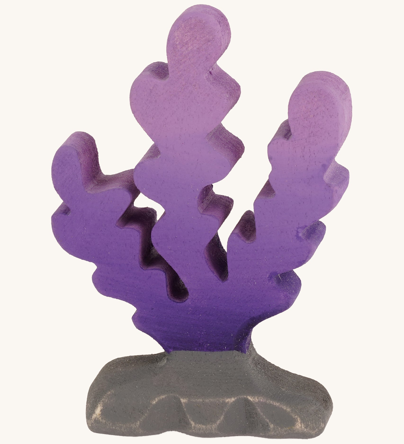 Bumbu wooden purple seaweed figure on a plain background.