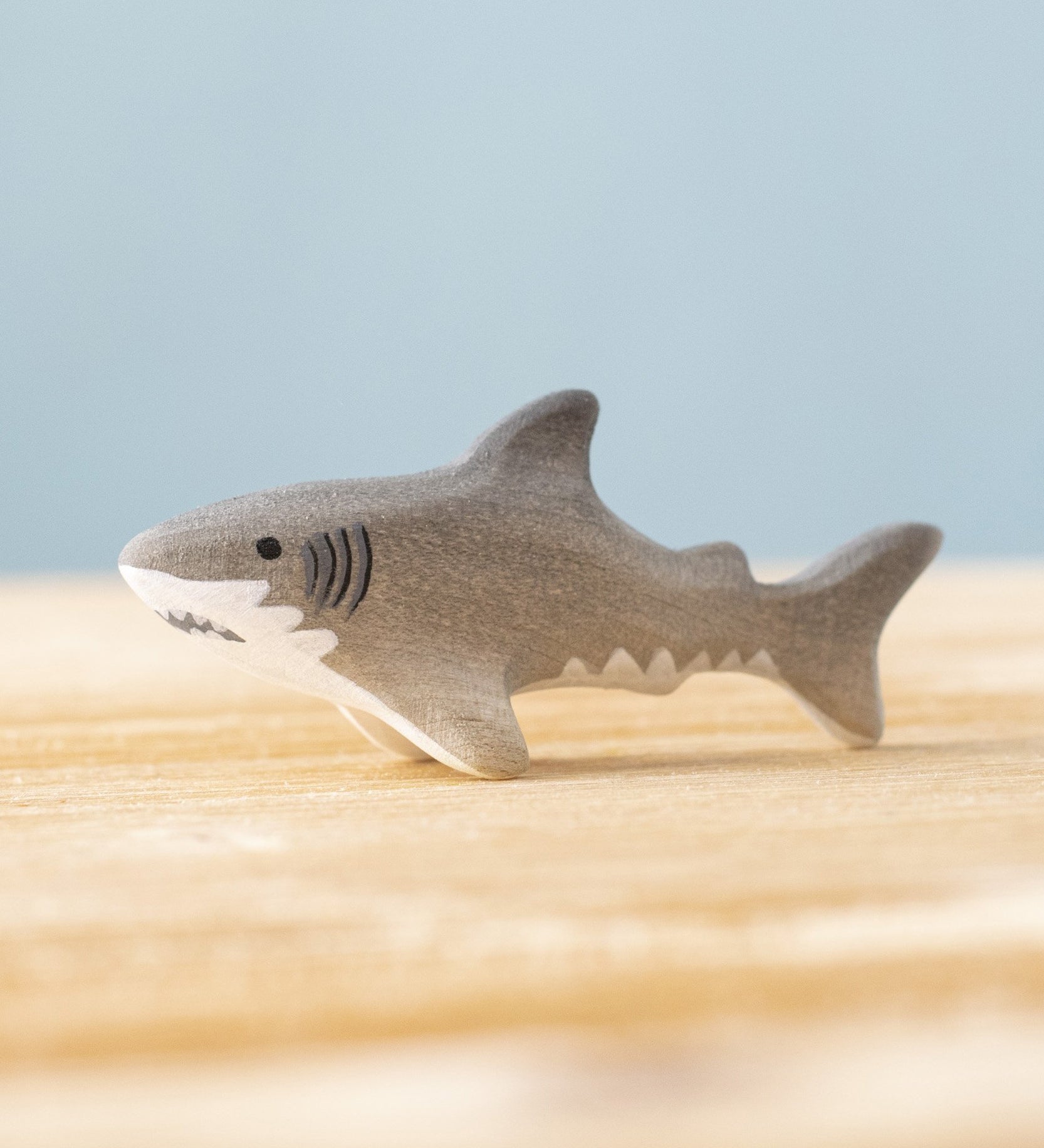 Bumbu handmade and hand painted wooden grey baby shark figure available at Babipur. 
