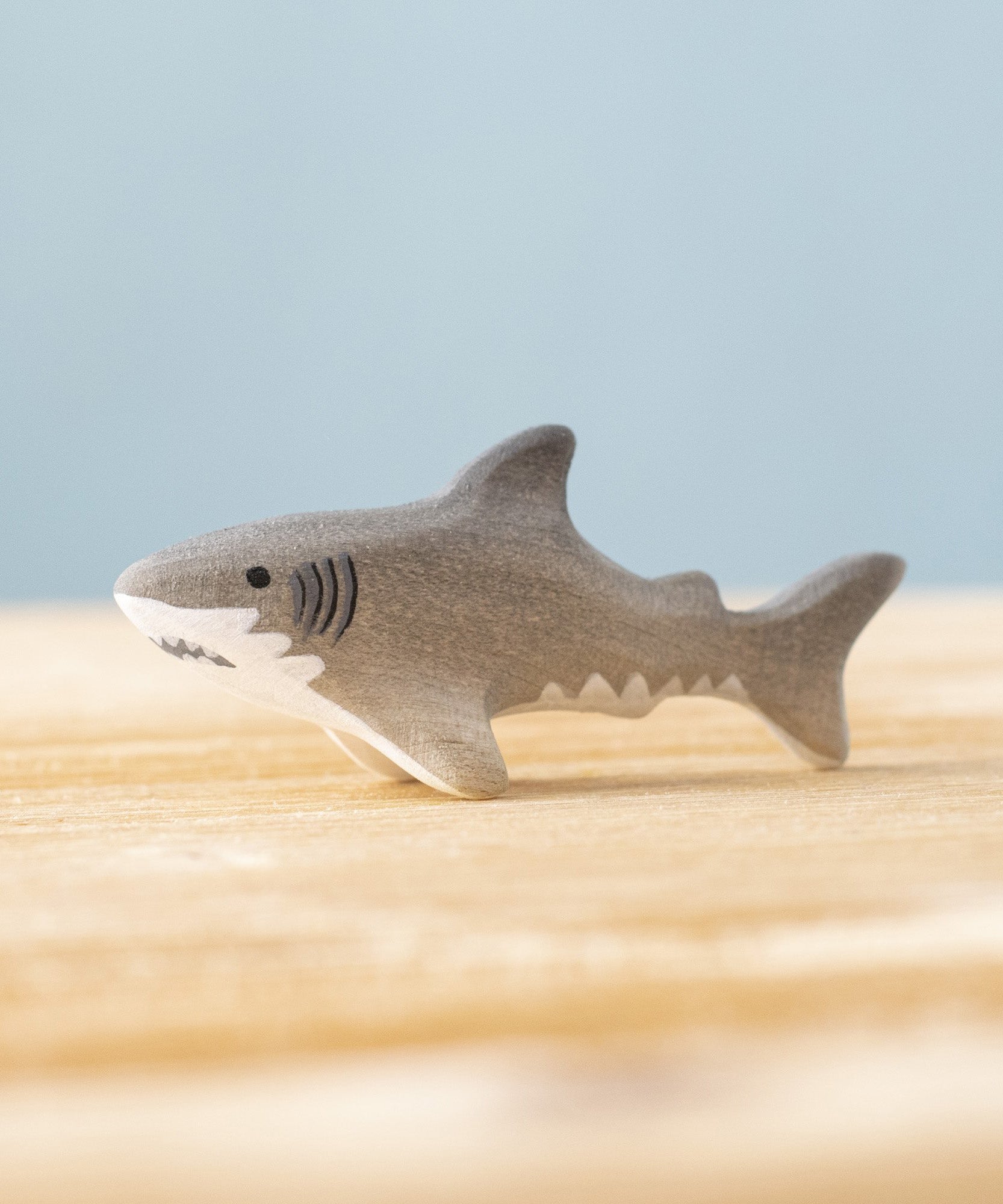 Bumbu handmade and hand painted wooden grey baby shark figure available at Babipur. 