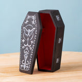 Bumbu handmade and hand painted wooden black coffin with white detail and red inside available at Babipur.