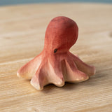 Bumbu handmade and hand painted wooden red octopus figure with cute facial features available at Babipur