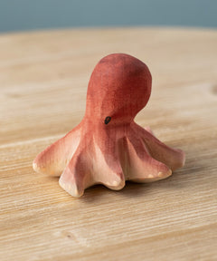 Bumbu handmade and hand painted wooden red octopus figure with cute facial features available at Babipur