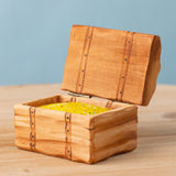 Bumbu handmade and hand painted wooden treasure chest available at Babipur. Features a lid with hinges and decorative gold inside