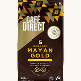 Gold Aztec design 200g bag holding the Cafe direct fair trade Mayan gold whole coffee beans