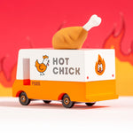 The The Candylab Candyvan - Fried Chicken Van from the back and side,  on a red fiery background