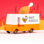 The The Candylab Candyvan - Fried Chicken Van from a side angle on a red fiery background