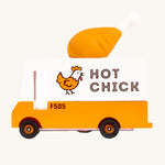 Candylab Candyvan - Fried Chicken Van, is a yellow and white van with a fun, rubber chicken drumstick on the top. The image is on a cream background