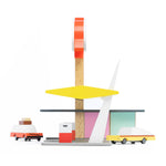 The side of the Candylab Rocket Fuel Station, with Candylab cars pulling into the petrol station