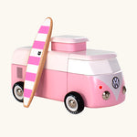 The Candylab VW Beach bus in pink, with a wooden pink and white stripe surf board propped up next to the van, The image is on a cream background