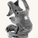 Carifit+ Fabric Baby Carrier in Grey, show from the side showing the adjustable straps, on a cream background