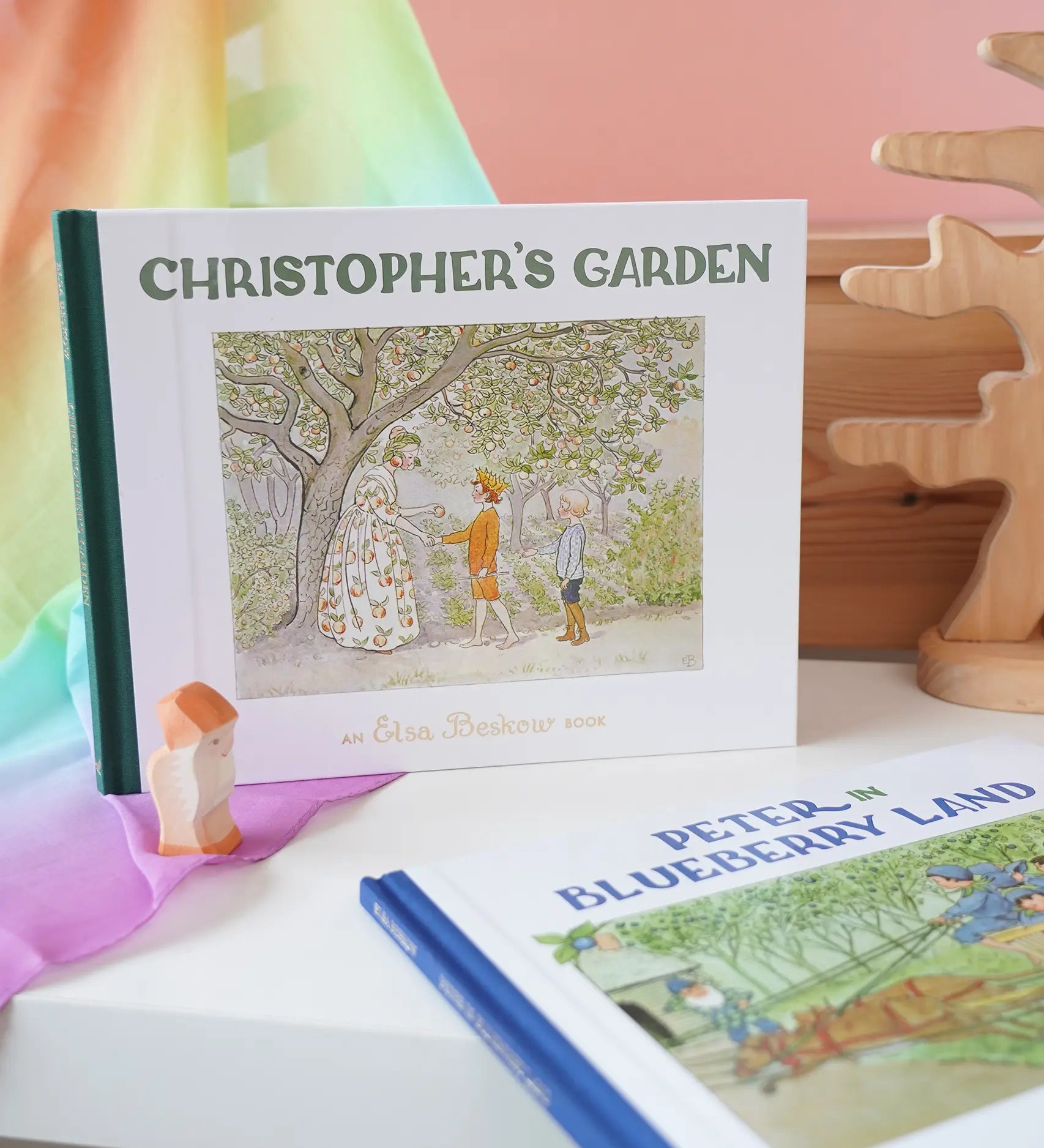 Christopher's Garden children's hardback book by Elsa Beskow on shelf next to another book from the series, Peter in Blueberry Land.