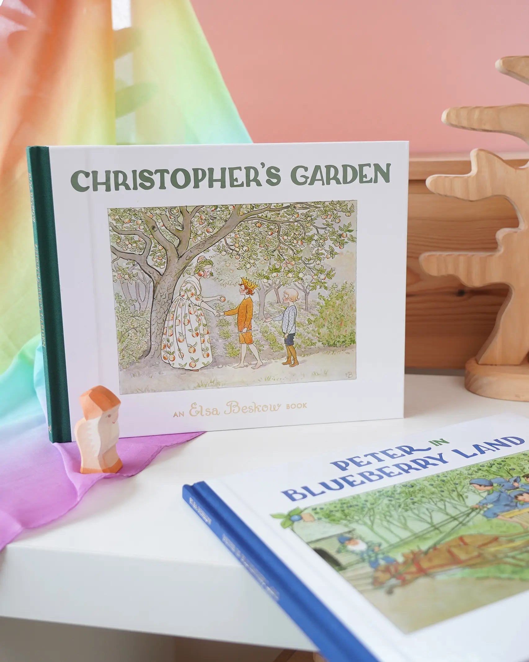 Christopher's Garden children's hardback book by Elsa Beskow on shelf next to another book from the series, Peter in Blueberry Land.