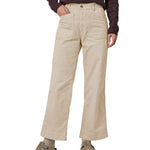 A person wearing thePatagonia Women's Wide Leg Cord Pants - Pumice, showing the flared style cut of the trouser legs